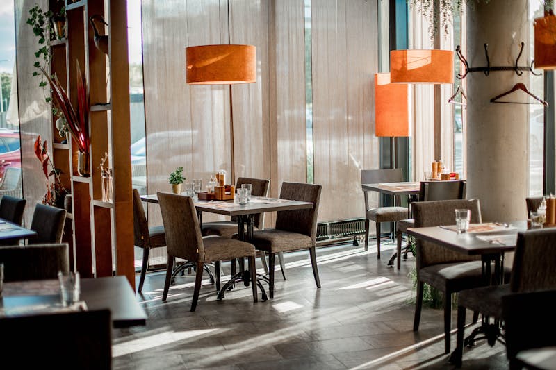 Cozy corner booth seating area inside Pizzana Houston