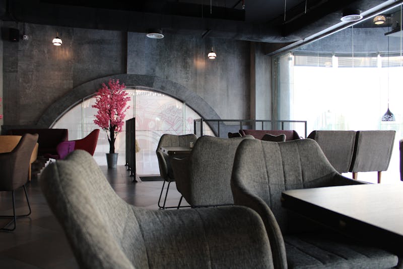 Pizzana bar and lounge area with ambient lighting in Houston